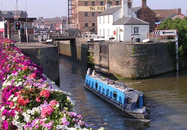 Gloucester Lock With Light Blue Boat Leaving